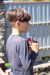 boy playing with toy gun