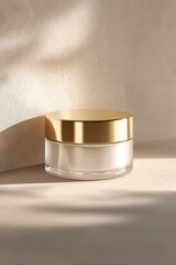 A soft beam of warm light highlights a refined cream jar resting on textured stone