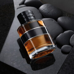 Luxurious perfume bottle on a black surface with black stones, captured in a dark, dramatic theme. Elegant high-end product shot with rich shadows and premium styling.