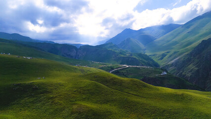 a drone flies over a campsite in a mountain gorge in the Jily-Su valley in the Caucasus, at the foot of Elbrus