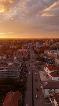 Verona,Italy-11 16 2025: Aerial drone flight over Verona&rsquo;s Borgo Corso Milano, showcasing residential buildings and the massive Esselunga supermarket in a dynamic urban cinematic view