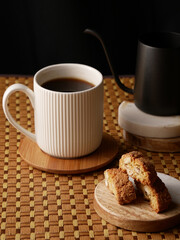 Black coffee with almond cookies cantucci.