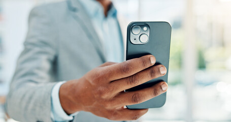 Hands, corporate and man with phone in office for research, stock market and trading online. Male person, mobile and reading for cryptocurrency, exchange rates and economic update on investment forum