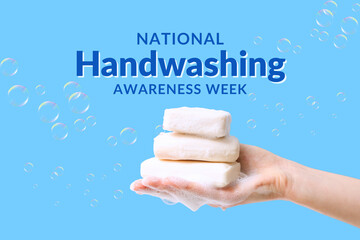 Hand holding three bars of soap surrounded by bubbles