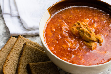 Delicious and aromatic red soup with meat, Ukrainian borscht. Traditional Ukrainian dish, cuisine
