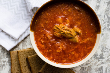 Delicious and aromatic red soup with meat, Ukrainian borscht. Traditional Ukrainian dish, cuisine