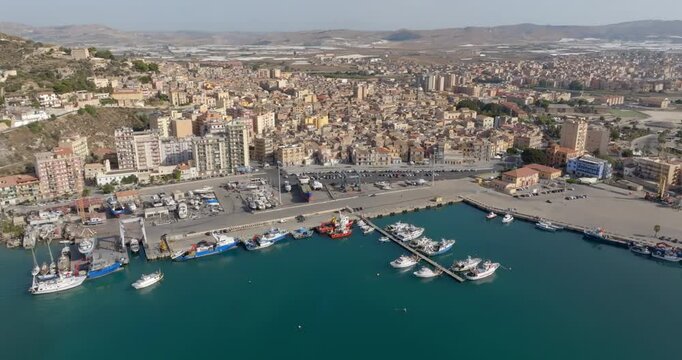 Aerial view of the port and city of Licata, a small town in the province of Agrigento, Sicily, Italy. The city seafront overlooks the Mediterranean Sea.