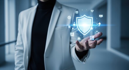 Man holds a digital shield representing network security and data protection in a futuristic tech environment