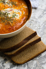 Delicious and aromatic red soup with meat, Ukrainian borscht with sour cream and dill. Traditional Ukrainian dish, cuisine