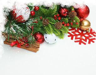 Festive christmas garland with ornaments pinecones and red snowflakes on white background