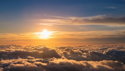 Obraz premium Serene Sunset Scene With Soft Puffy Clouds Illuminated By Golden Light Creating A Peaceful And Ethereal Atmosphere Above A Sea Of Fluffy Clouds