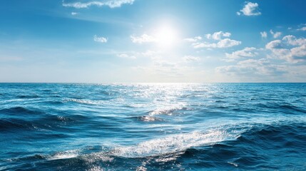 Fototapeta premium Sunny sky with fluffy clouds above deep blue ocean water. Beautiful summer marine landscape for travel and nature background.