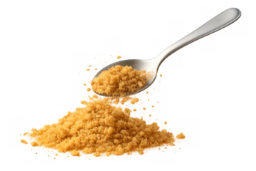 Brown sugar falling from a metal spoon, creating a heap of granular brown sweetener, perfect for food and recipe designs