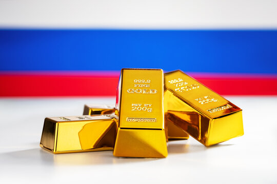 Gold bars on the Russian flag background. Concept of Russia gold reserves.