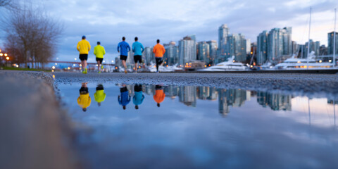 Group of five people jogging along waterfront path with city skyline and yachts in background during early evening