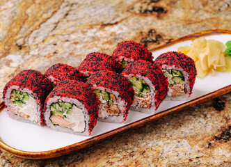 Delicious sushi rolls with colorful toppings served on a plate