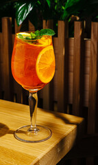 Refreshing citrus drink served in a tall glass on a wooden table