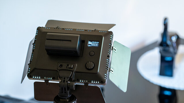 Professional LED panel light with battery pack for studio photography or video productio.