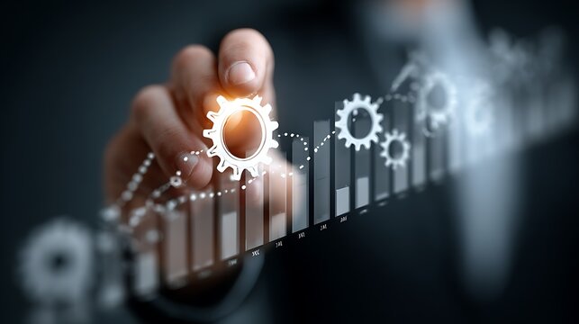 Hand interacting with virtual gears and growth data chart on screen - Powered by Adobe