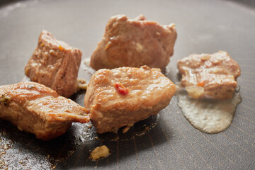 Close-up of stewed beef meat in a frying pan