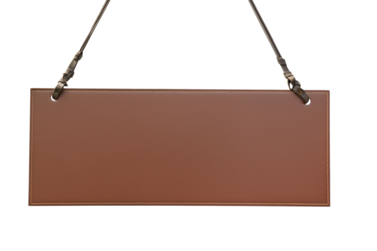 Rectangular brown leather sign with black straps and silver clips on transparent background