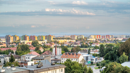 Wide panorama of colorful apartment blocks and suburban houses, Poland