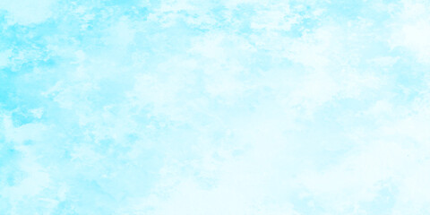 Light blue blurred grainy and cloudy sky with soft clouds, cloudy and shiny blurred grainy soft splashed texture, bright grunge sky light blue watercolor background.