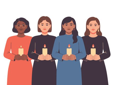 Four women stand together holding lit candles in a solemn display.