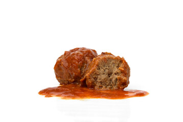 Fish meatballs in tomato sauce isolated on white background.