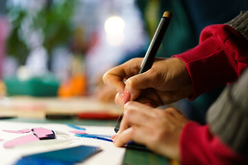 Making stained glass during artistic workshop. 
