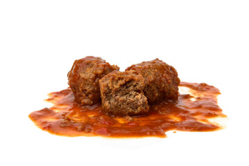 Fish meatballs in tomato sauce isolated on white background.