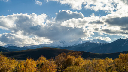 mountain peaks in the clouds. a beautiful mountain gorge. autumn in the mountains
