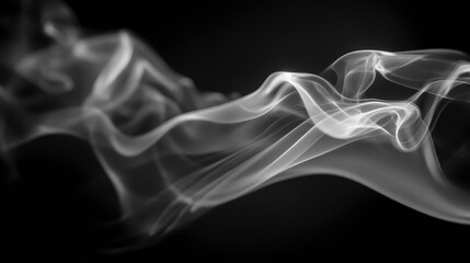 Abstract smoke wisps drifting over a deep black background in monochrome