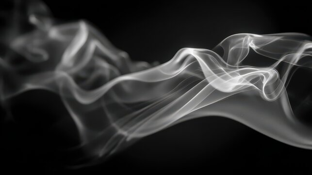 Abstract smoke wisps drifting over a deep black background in monochrome