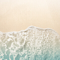 Aerial view of clean and transparent blue ocean waves on a beautiful sandy beach. Natural background