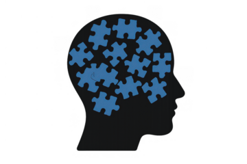 Human head silhouette showing brain, mind, and psychology concepts with various blue jigsaw puzzle pieces on transparent background