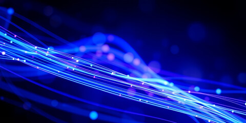 Abstract blue light trails flowing through darkness