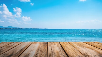 Peaceful seaside view with wooden deck against bright blue ocean and clear sky, ideal for relaxation and vacation imagery, capturing tranquility and beauty