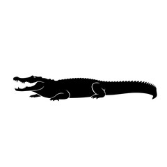 Fototapeta premium Silhouette of a large crocodile with an open mouth, showing teeth, and a long tail.