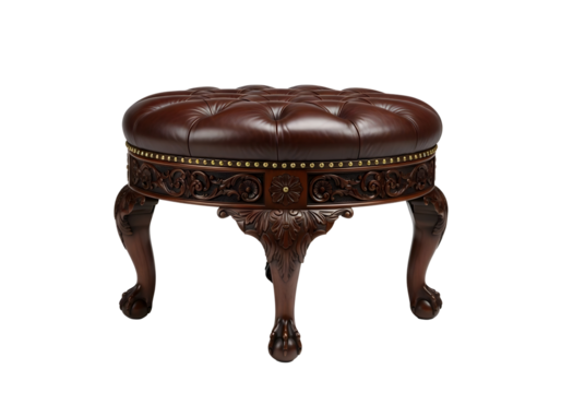 Ornate dark brown leather tufted ottoman with carved wooden base isolated on transparent background