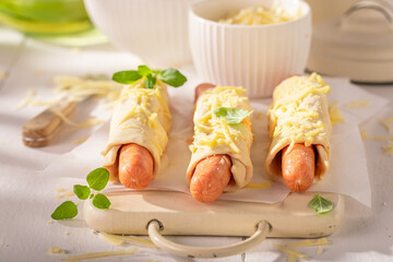 Tasty hot dogs with herbs and cheddar cheese.