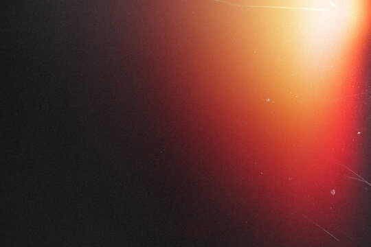light leak overlay effect with scratch dust and blur orange light,retro noisy film texture light leak flare on black background,abstract background with colorful light,grunge old film burn ray lens - Powered by Adobe