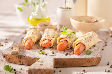 Tasty hot dogs with pepper and puff pastry.