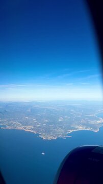  View from the airplane window to the blue sea