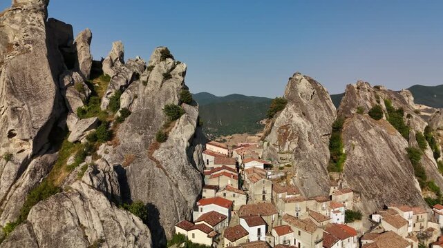 Aerial view of Castelmezzano village with traditional red rooftops, Basilicata, Italy
