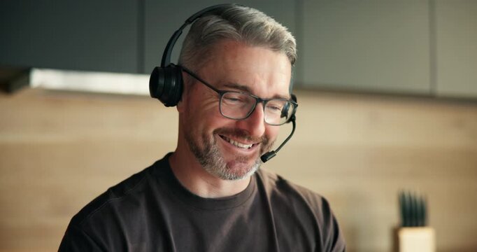 Tech support, agent and man with headset, home and talking with contact or help with troubleshooting. Happy, virtual assistant and mature person with mic for chat, problem solving and IT solution
