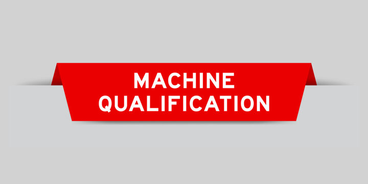 Red color inserted label with word machine qualification on gray background