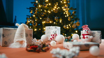 Christmas table with ornaments, puppets and gifts for children