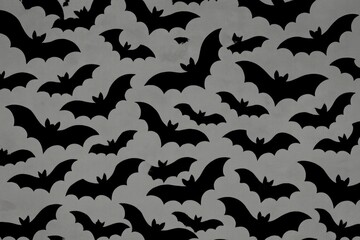 Silhouettes of flying bats.