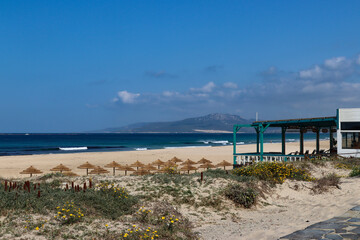 Beach of Los Lances on the Atlantic side of the Strait of Gibraltar, the 7 km long sandy beach known for windsurfing sports (Tarifa, Spain)